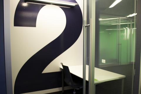 Business Cubicle interior shot with table and single chair