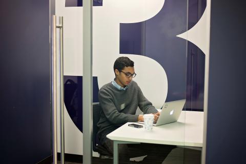 Business Cubicle 3 interior shot with single chair and table